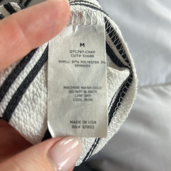 Straight cut, flared sleeve blouse with black tie up in back. Green Envelope. - Picture 10 of 10